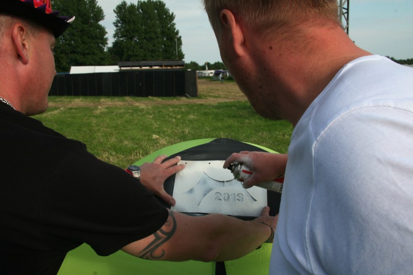 Fans branding their tent with 2013 Logo Photo by Robin Elizabeth Herr